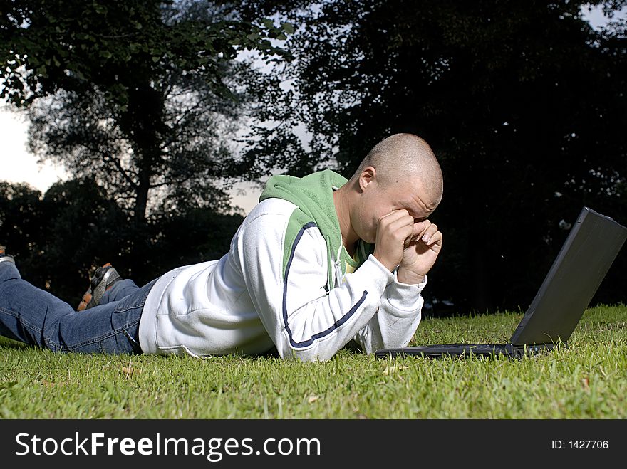 Picture of boy with notebook in park