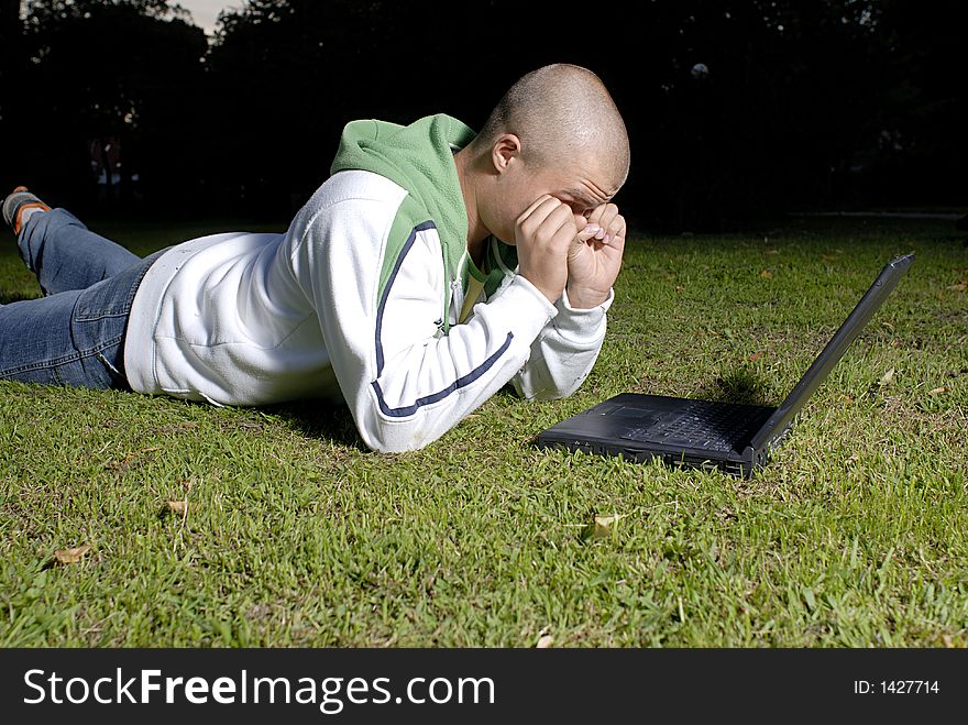 Boy with notebook in park