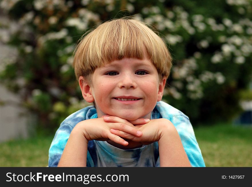 Boy with head on hands