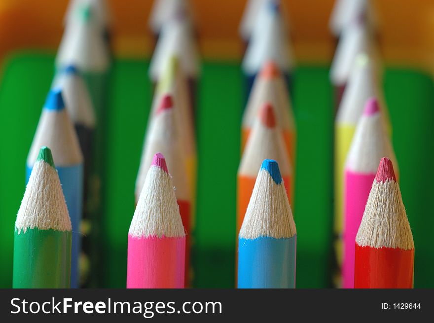 A set of colored pencils with blur background