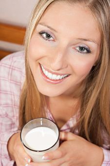 Woman In Bed With Glass Of Milk Royalty Free Stock Photography