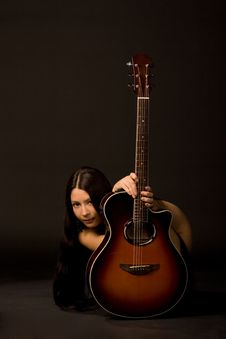 Attractive Girl Hiding Behind A Guitar Royalty Free Stock Images Attractive Girl Hiding Behind A Guitar Royalty Free Stock Images