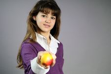 One School Girl Offering Healthy Fruit Stock Photo