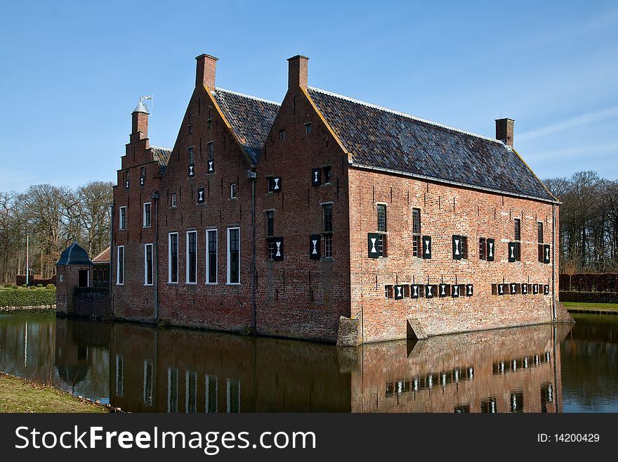 Old medieval mansion with water defence