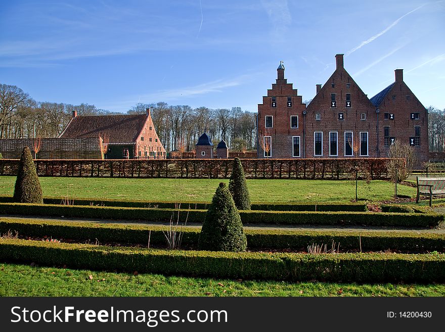 Old medieval mansion with french garden around. Old medieval mansion with french garden around