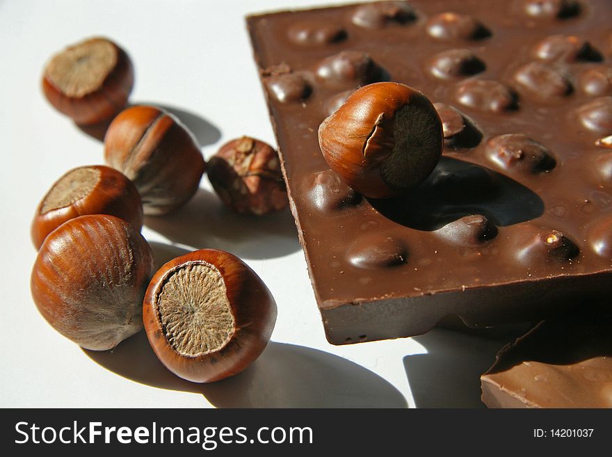 Tile of a milk chocolate and wood nut. Tile of a milk chocolate and wood nut