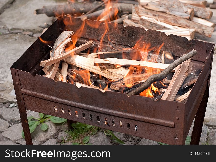 Brazier with brightly burning wood. Brazier with brightly burning wood