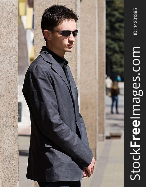 Young adult european man in black sunglasses. Young adult european man in black sunglasses