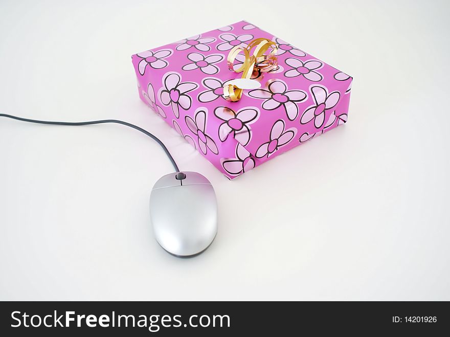 A present with a computer mouse. A present with a computer mouse