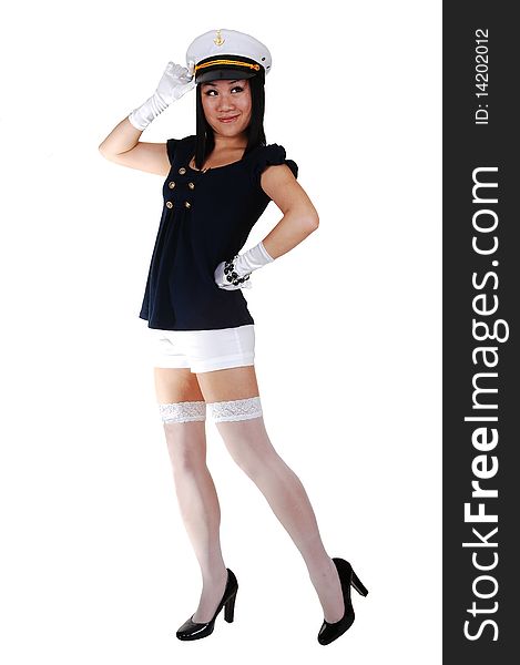 A pretty young Asian woman, in a sailor uniform, in white shorts, stockings
and gloves, in high heels and a sailor cap, standing saluting in the studio. A pretty young Asian woman, in a sailor uniform, in white shorts, stockings
and gloves, in high heels and a sailor cap, standing saluting in the studio.