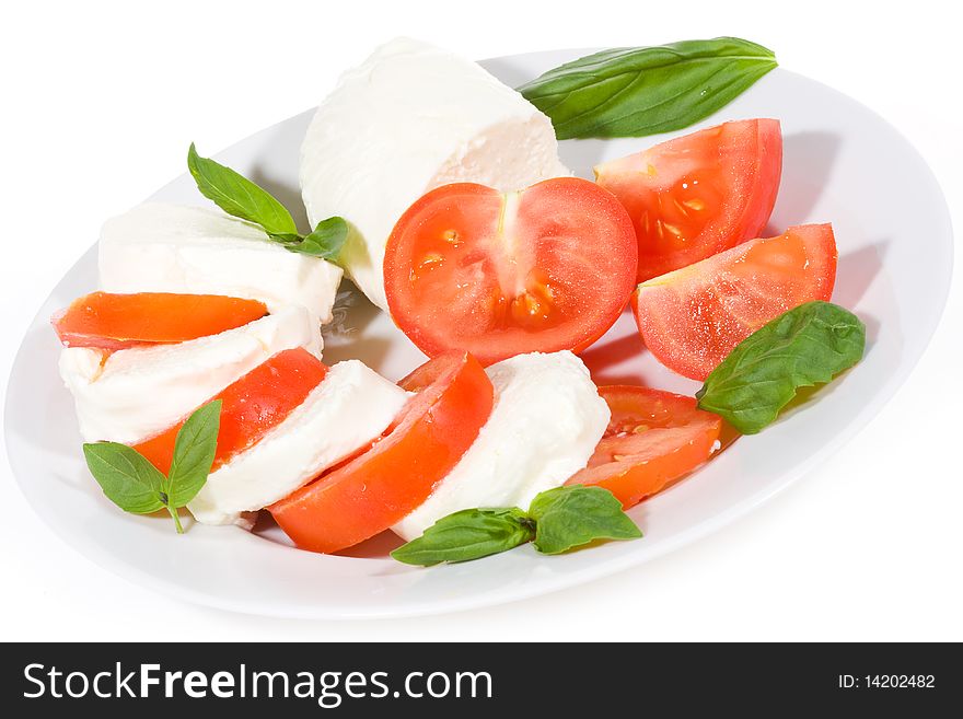 Mozzarella and tomatoes on white background