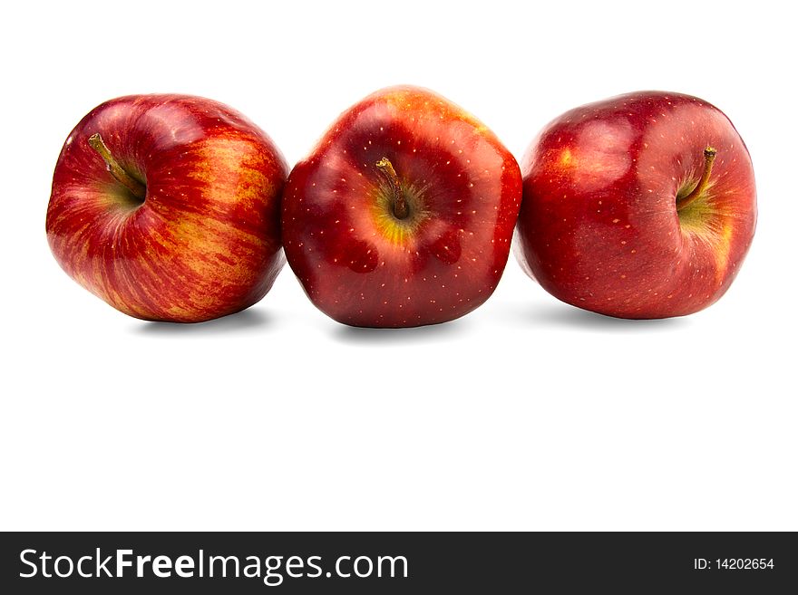 Three apple lying next on a white background. Three apple lying next on a white background