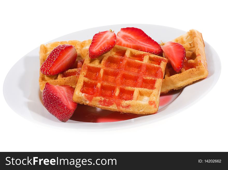 Waffles with strawberries on white background