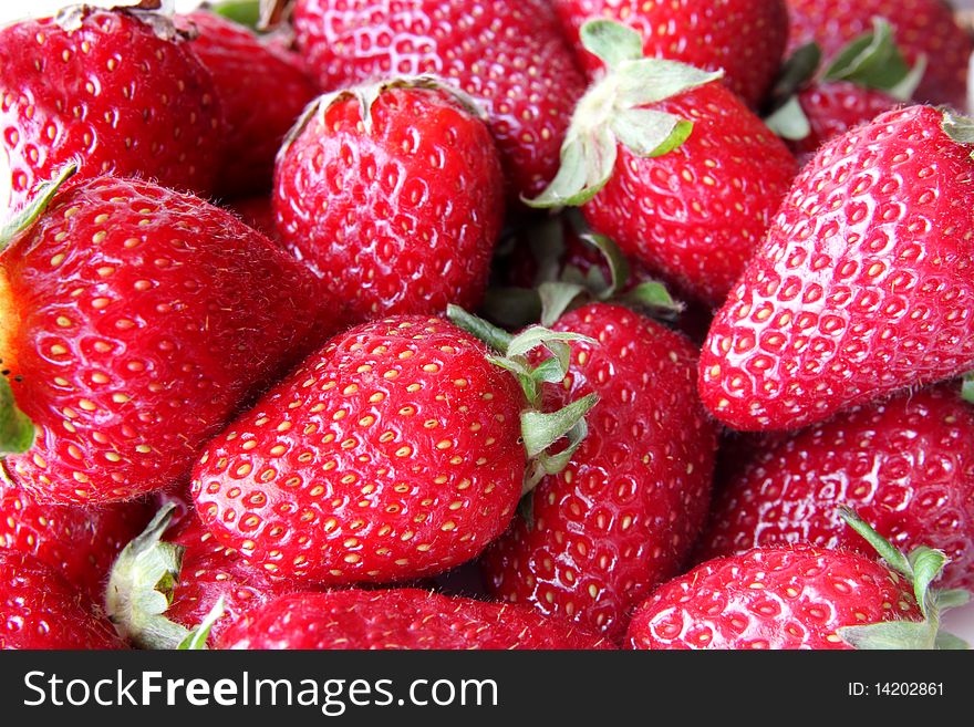 Close up lot of fresh strawberries .