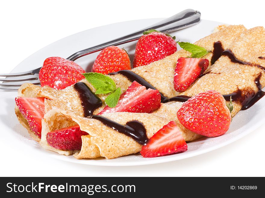 Pancakes with strawberry on white background