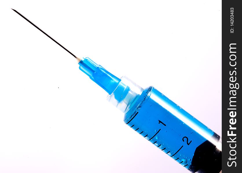Blue Syringe With Hypodermic Needle on WhiteBackground