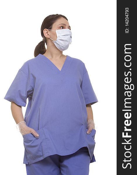 Female doctor in surgical mask and scrubs