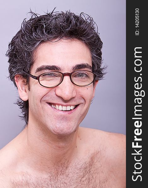 Goofy looking young man in eyeglasses