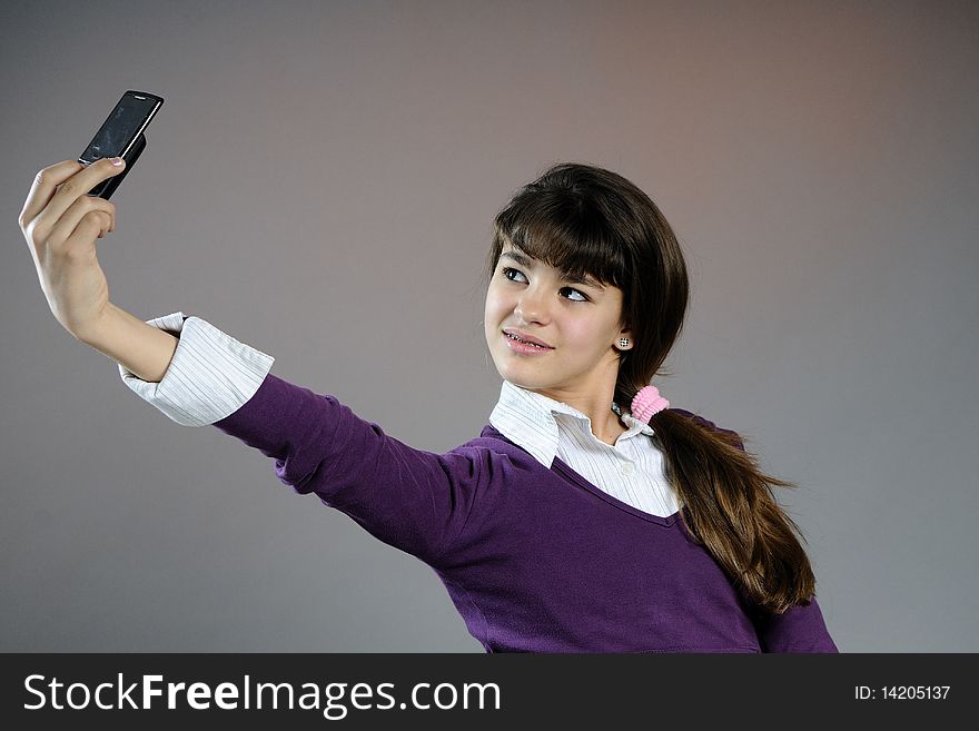 Teenager making photos with mobile phone
