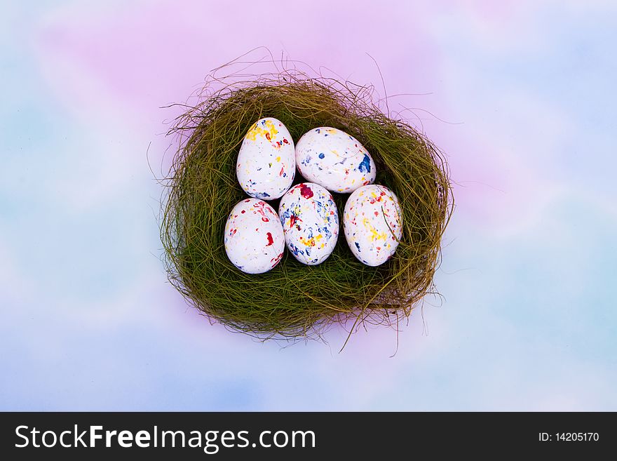 Colorful Easter eggs in a bird nest. Colorful Easter eggs in a bird nest