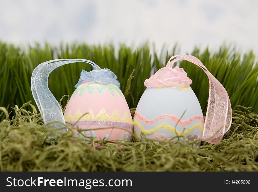 Decorative easter eggs on green grass