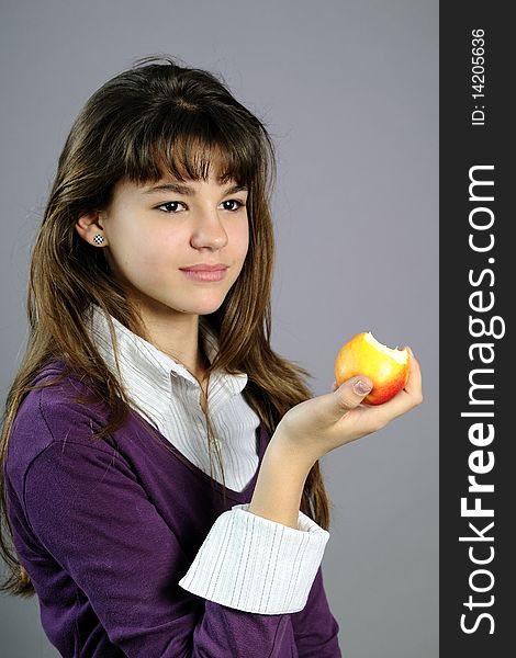 Beautiful School Girl Eating Healthy Fruit