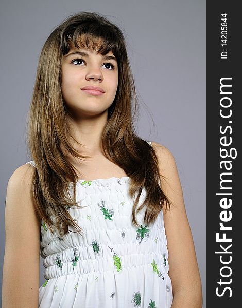 Beautiful teenager posing in studio with clothes. Beautiful teenager posing in studio with clothes