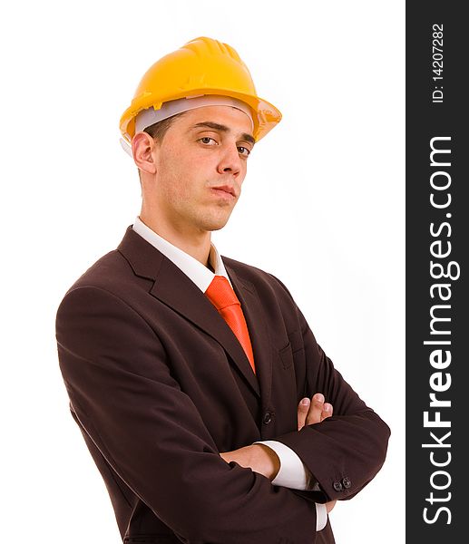 Young engineer portrait with a yellow helmet, isolated on white
