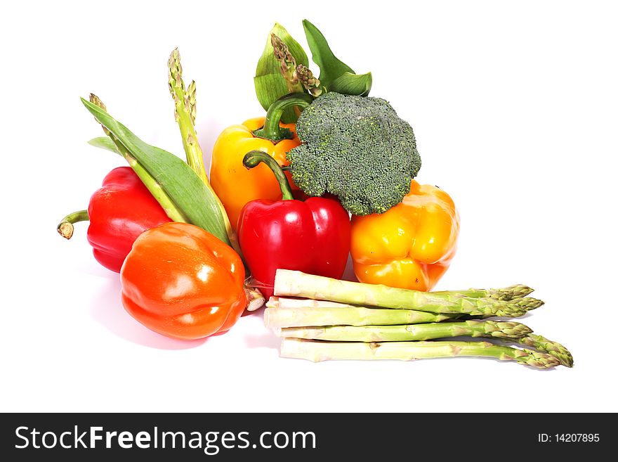 Heap of fresh ripe vegetables isolated at white background