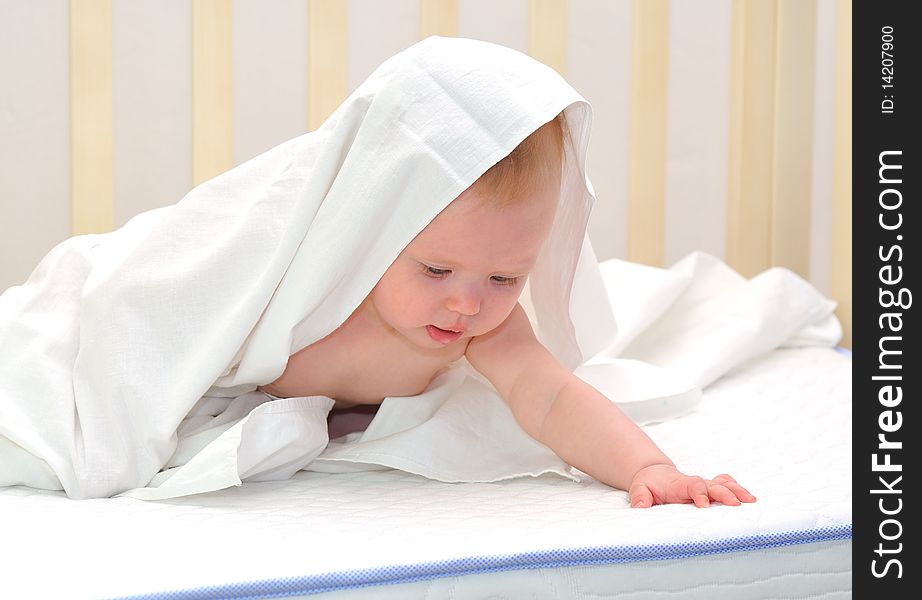 Little baby under white towel. Little baby under white towel.