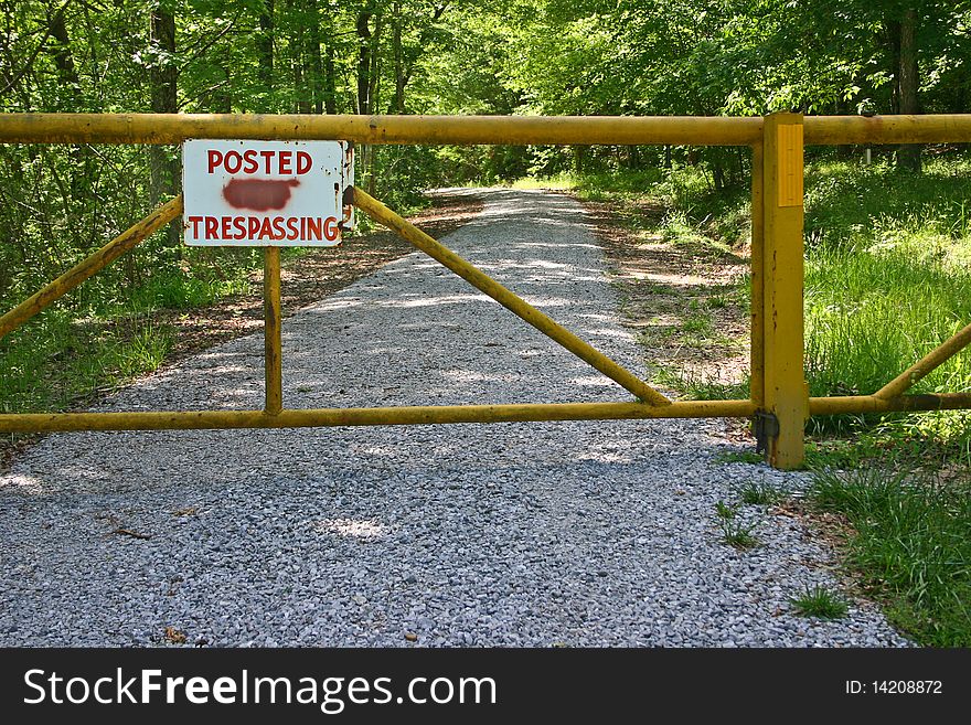 Sign, Posted No Trespassing, with the 'no' painted out. Sign, Posted No Trespassing, with the 'no' painted out