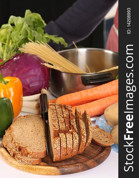 Bread, carrot, red cabbage and peppers in close up. Bread, carrot, red cabbage and peppers in close up