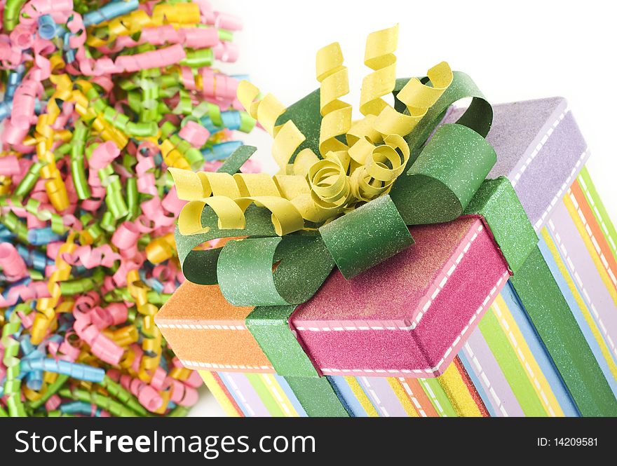 A decorative party box with colorful party ribbons on a horizontal background with copy space. A decorative party box with colorful party ribbons on a horizontal background with copy space