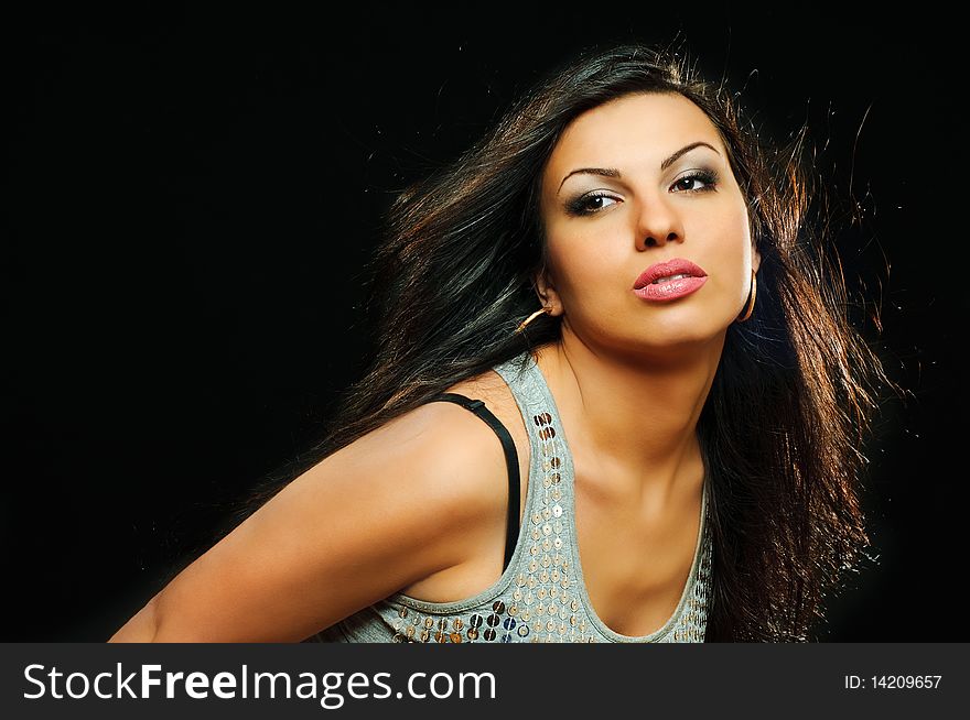 Portrait of beauty brunette girl on black background