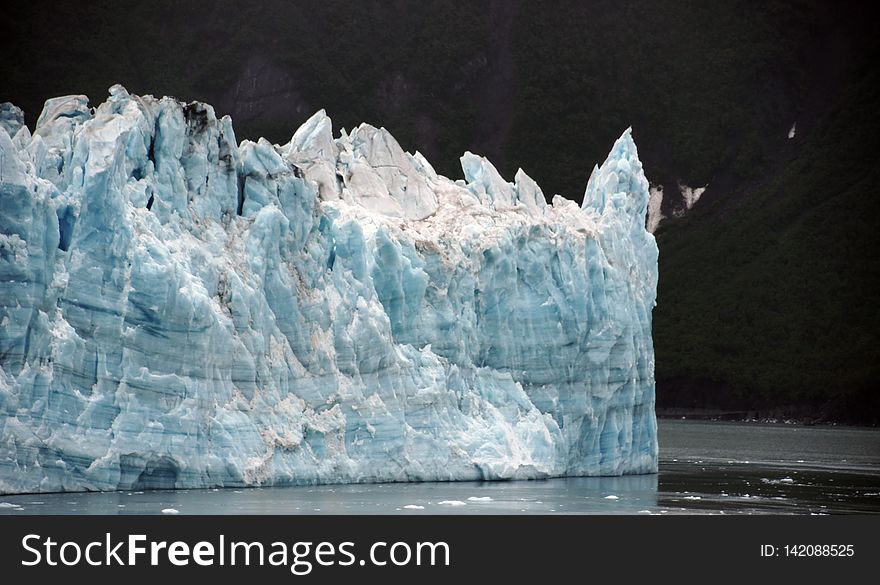 The longest source for Hubbard Glacier originates 122 kilometres &#x28;76 mi&#x29; from its snout and is located at about 61Â°00â€²N 140Â°09â€²W, approximately 8 kilometres &#x28;5 mi&#x29; west of Mount Walsh with an altitude around 11,000 feet &#x28;3,400 m&#x29;. A shorter tributary glacier begins at the easternmost summit on the Mount Logan ridge at about 18,300 feet &#x28;5,600 m&#x29; at about 60Â°35â€²0â€³N 140Â°22â€²40â€³W. Before it reaches the sea, Hubbard is joined by the Valerie Glacier to the west, which, through forward surges of its own ice, has contributed to the advance of the ice flow that experts believe will eventually dam the Russell Fjord from Disenchantment Bay waters. The longest source for Hubbard Glacier originates 122 kilometres &#x28;76 mi&#x29; from its snout and is located at about 61Â°00â€²N 140Â°09â€²W, approximately 8 kilometres &#x28;5 mi&#x29; west of Mount Walsh with an altitude around 11,000 feet &#x28;3,400 m&#x29;. A shorter tributary glacier begins at the easternmost summit on the Mount Logan ridge at about 18,300 feet &#x28;5,600 m&#x29; at about 60Â°35â€²0â€³N 140Â°22â€²40â€³W. Before it reaches the sea, Hubbard is joined by the Valerie Glacier to the west, which, through forward surges of its own ice, has contributed to the advance of the ice flow that experts believe will eventually dam the Russell Fjord from Disenchantment Bay waters.