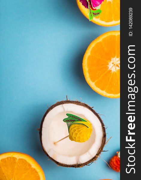 Among the juicy oranges on a blue background. Summer Food Concept. Top view, flat lay, copy space. Among the juicy oranges on a blue background. Summer Food Concept. Top view, flat lay, copy space