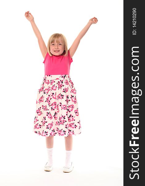 Young little girl with arms up looking happy. Young little girl with arms up looking happy
