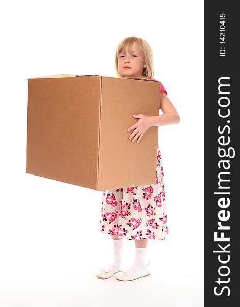Young little girl holding large cardboard box. Young little girl holding large cardboard box
