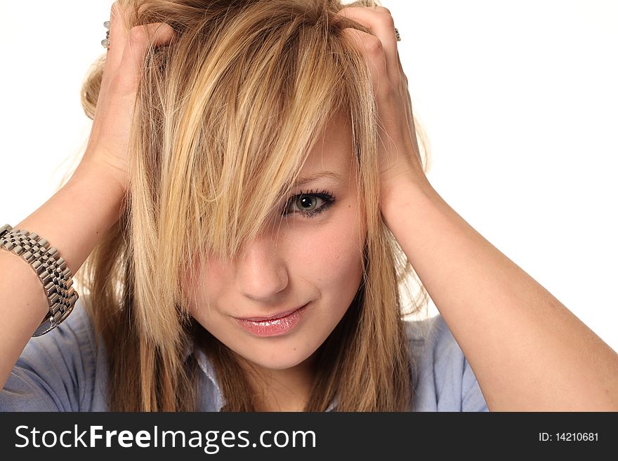 Attractive young teenage girl isolated on white background, with messy hair looking stressed. Attractive young teenage girl isolated on white background, with messy hair looking stressed