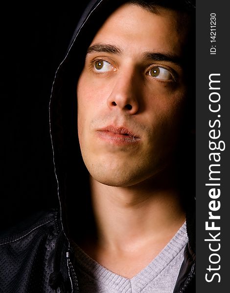 Portrait of a young casual man on black background. Portrait of a young casual man on black background