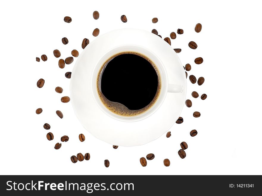 Cup of coffee surrounded by beans - isolated on white background
