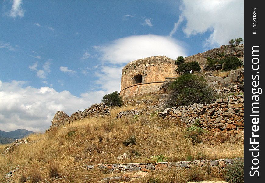 Medieval tower ruins on the hill in the Spinalonga fortress, in Crete, Greece,. Medieval tower ruins on the hill in the Spinalonga fortress, in Crete, Greece,