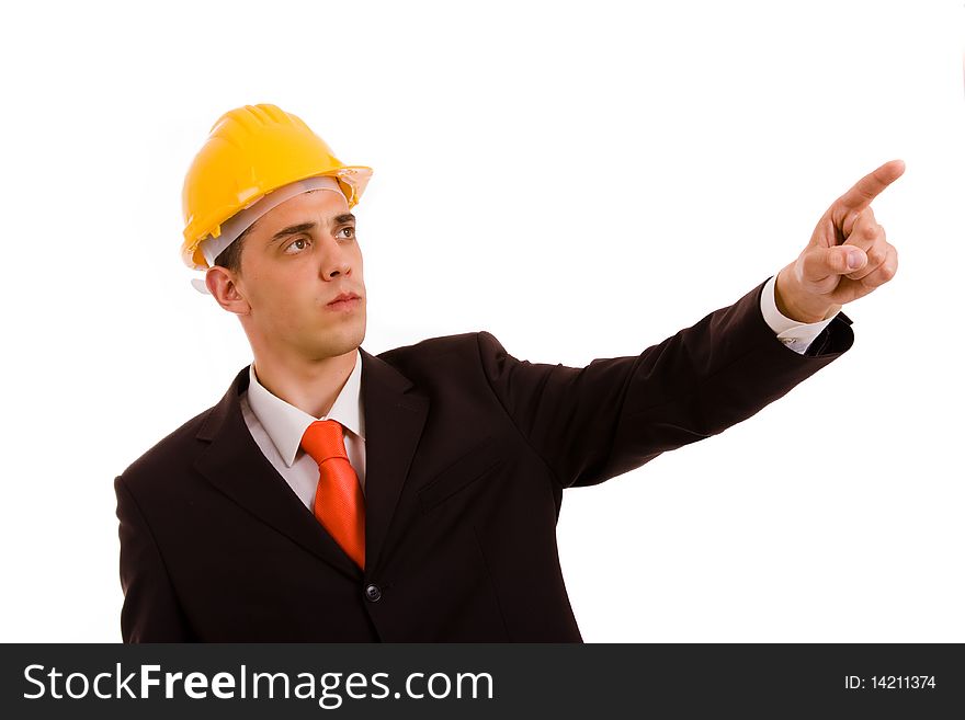 Young engineer pointing with is finger in a suit, isolated on white