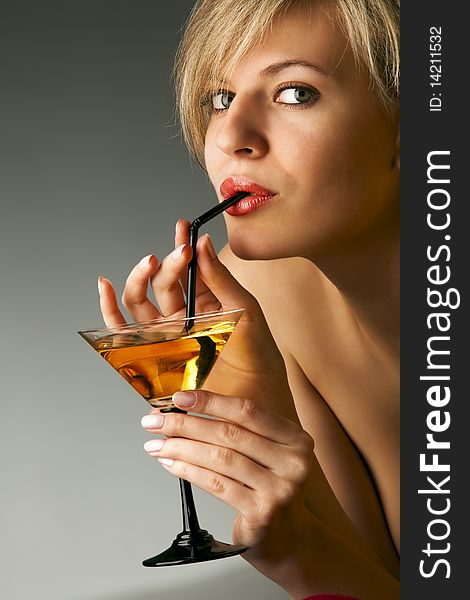 Woman with glass of cocktail
