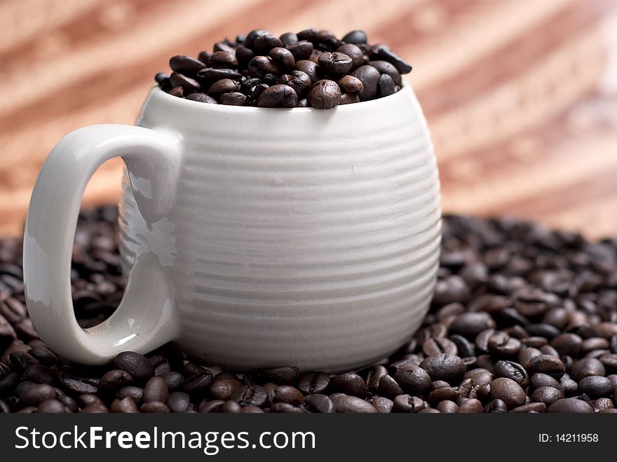 Coffee Beans In A Cup With Ethnic Mood
