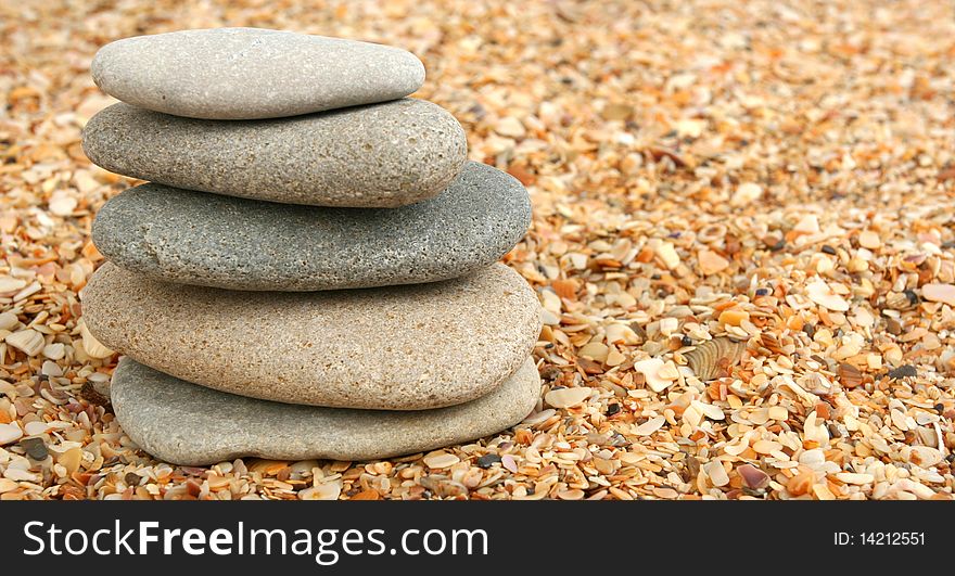 Stones on sand close up