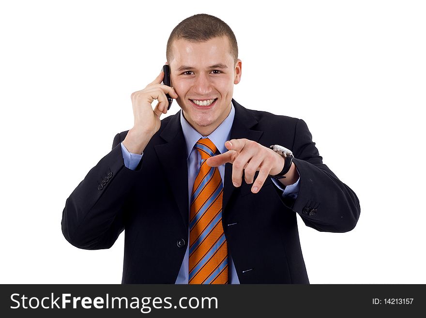 A handsome businessman pointing with finger while talking on the phone. All on white background. A handsome businessman pointing with finger while talking on the phone. All on white background.