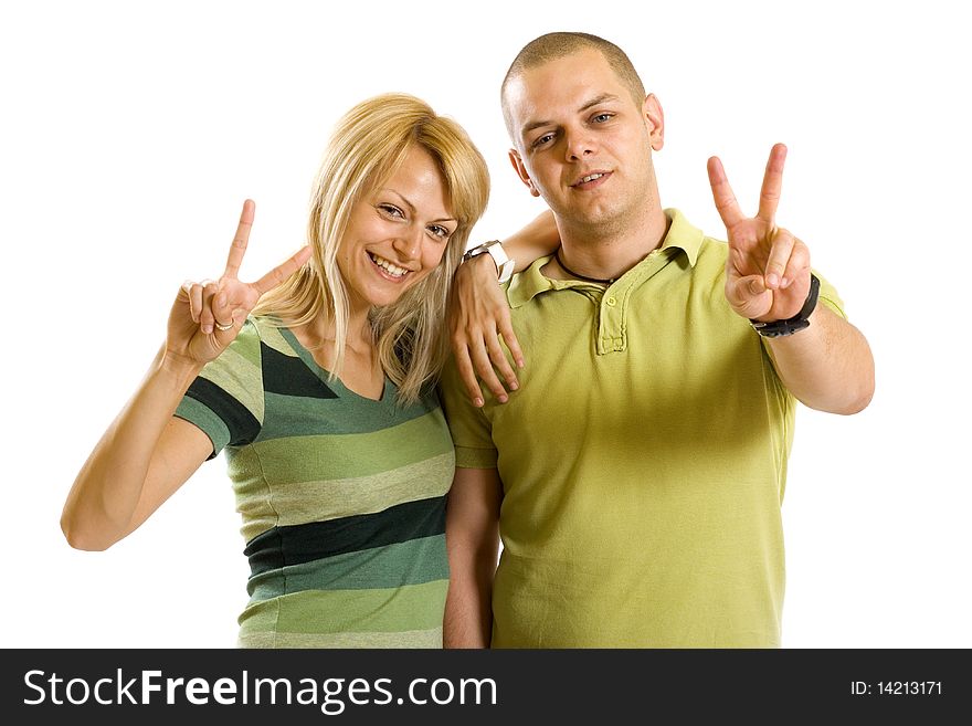 Couple making their victory sign over white background. Couple making their victory sign over white background