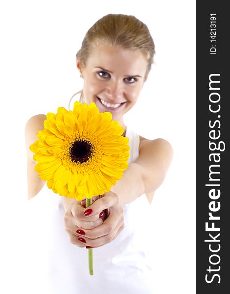 Beautiful angelic woman with flower in her hands - focus is on the flower