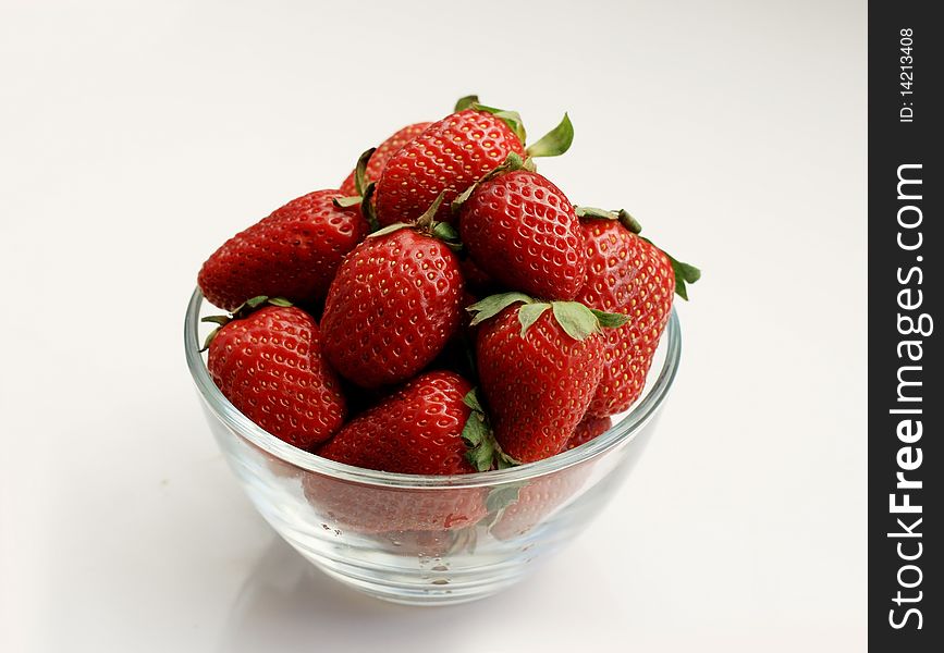 Juicy strawberries in a glass bowl. Juicy strawberries in a glass bowl